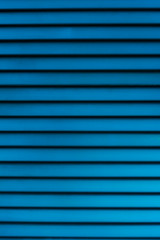 Obraz premium Blue-colored horizontal boards in light defocus for use as background