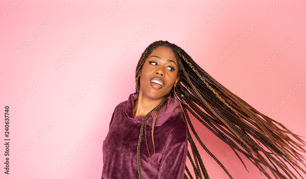 Wall mural African American woman on pink background