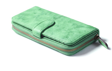 Green leather purse with zipper close-up on a white background.