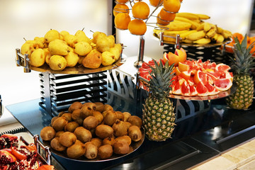 fresh fruit plates on the table lay a restaurant kitchen