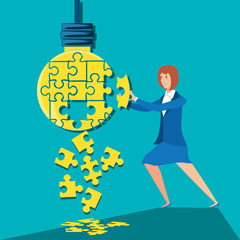 businesswoman with puzzle pieces in shape light bulb
