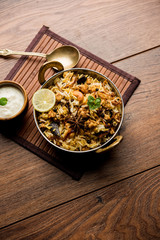 Keema or Kheema Biryani - Fragrant and spicy minced lamb or goat or chicken cooked in range of aromatic spices with basmati rice. served in a karahi with curd. selective focus