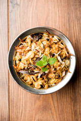 Keema or Kheema Biryani - Fragrant and spicy minced lamb or goat or chicken cooked in range of aromatic spices with basmati rice. served in a karahi with curd. selective focus