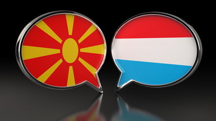 Naklejka premium Macedonia and Luxembourg flags with Speech Bubbles. 3D illustration