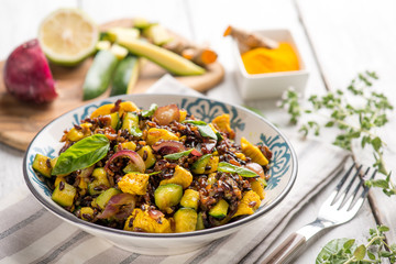 red rice salad with chicken zucchinis and tumeric