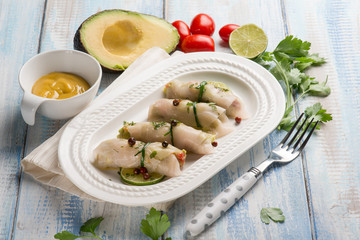swordfish rolled up stuffed with avocado and mustard
