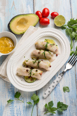 swordfish rolled up stuffed with avocado and mustard