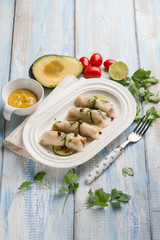swordfish rolled up stuffed with avocado and mustard