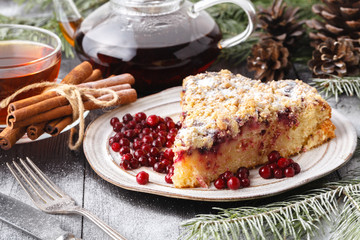 Traditional Christmas cake shtollen on a wood background