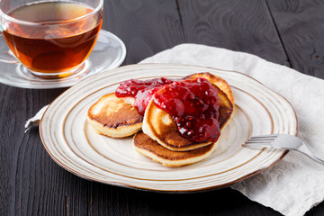 Homemade pancakes with berry sauce coulis