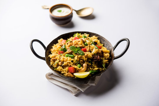 Kheema Pulao - Rice cooked with mutton or chicken mince with vegetables and spices. served in a bowl. selective focus