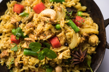 Kheema Pulao - Rice cooked with mutton or chicken mince with vegetables and spices. served in a bowl. selective focus
