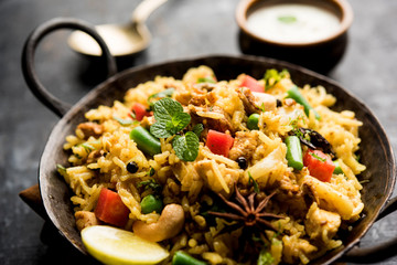 Kheema Pulao - Rice cooked with mutton or chicken mince with vegetables and spices. served in a bowl. selective focus