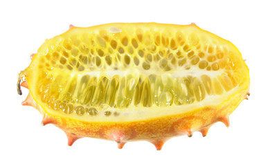 Ripe yellow horned melon or kiwano fruit cut in half lengthwise isolated on white background