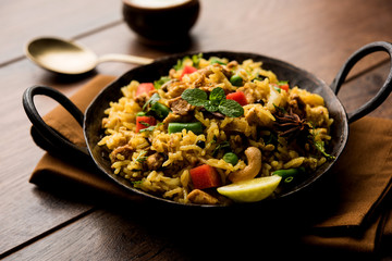 Kheema Pulao - Rice cooked with mutton or chicken mince with vegetables and spices. served in a bowl. selective focus