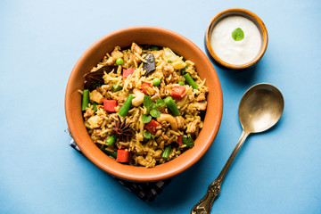 Kheema Pulao - Rice cooked with mutton or chicken mince with vegetables and spices. served in a bowl. selective focus