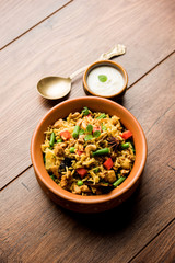 Kheema Pulao - Rice cooked with mutton or chicken mince with vegetables and spices. served in a bowl. selective focus