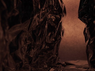 Passage between two rocks. Fantastic landscape of crumpled aluminum foil.