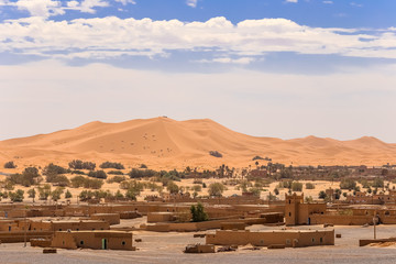 Naklejka na ściany i meble View over Merzouga village and sand dunes Morocco