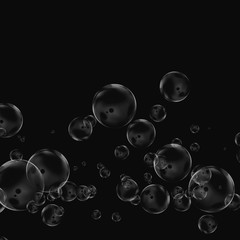 White air bubbles isolated on black background. Underwater oxygen. Soap closeup.