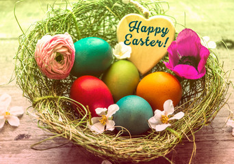 Frohe Ostern, Osternest mit bunten Ostereiern und Herz - Happy Easter, Easter nest with colorful Easter eggs and heart