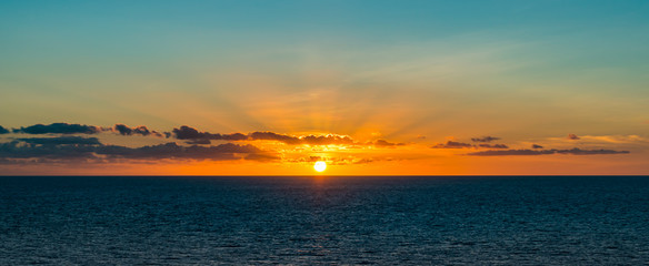 Panoramic view of beautiful sunset over the sea. 