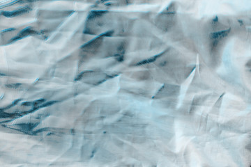 Ocean blue textile background. Silk cloth texture. Fabric jeans pattern.