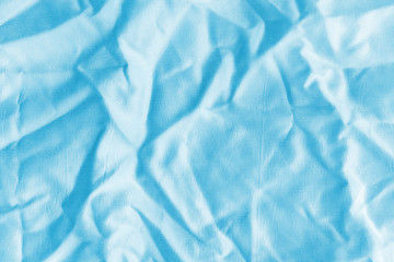 Obraz premium Ocean blue textile background. Silk cloth texture. Fabric jeans pattern.