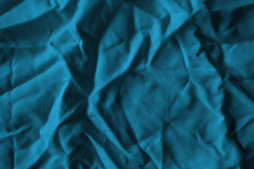 Ocean blue textile background. Silk cloth texture. Fabric jeans pattern.