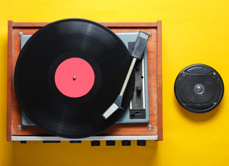 Retro style, pop culture attributes on a yellow background. Vinyl player,speaker. Top view, flat lay