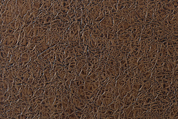Artificial leather. Crumpled copper foil. Texture for background and design.
