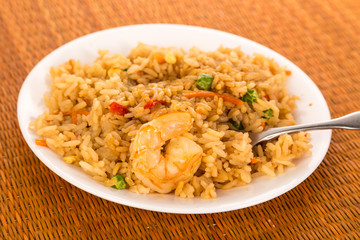 Bowl of Shrimp Fried Rice on Bamboo with Fork