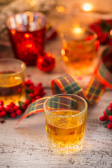 Whiskey, brandy or liquor shot and Christmas decorations