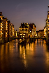 Fototapeta premium The Hamburg Warehouse District (Speicherstadt) is the world's largest historic warehouse complex, located in the Port of Hamburg, Germany. Concept: travel or sights