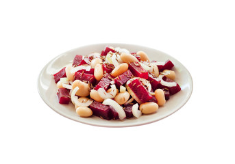 Beetroot salad with white kidney beans, pickles and onion, dressed with oil and flavored with caraway seeds isolated on white background with clipping path