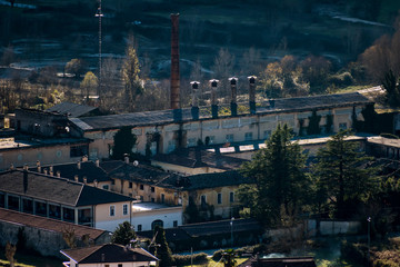 overview of old abandoned paper mill factory in rural environment
