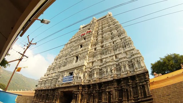 Beautiful ancient southern gate tower with statues on walls temple of fire Tiruvannamalai post wires