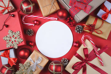 Christmas presents and accessories on red.