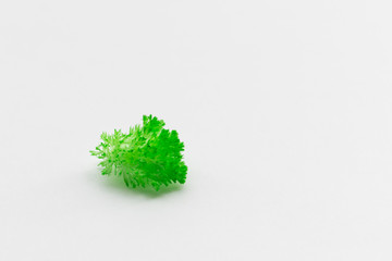 Fototapeta premium Green grown crystals on white paper