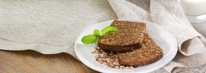 Bread slices with seeds on a white dish