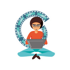 man sitting with laptop and video tape