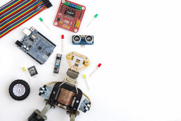 A metal robot and an electronic board that can be programmed. Robotics and electronics. DIY...