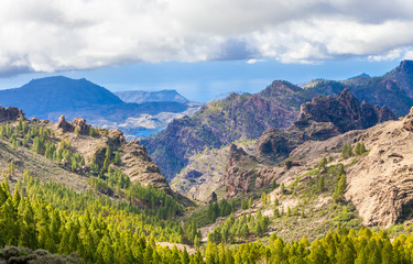 Fototapeta na wymiar Mountain landscape with lake, green hills and white clouds. Gran Canaria.