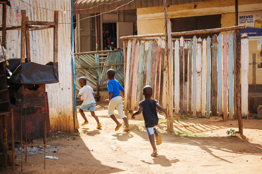 Children running on the street in Uganda, Africa