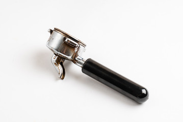 Coffee barista scoop or spoon machine full of ground coffee isolated