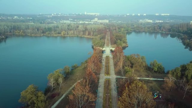 Aerial footage over Echo Park Lake, Kishinev, Moldova republic of. View of lake and smille bridge.