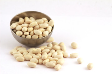 metal bowl of white beans isolated on white background