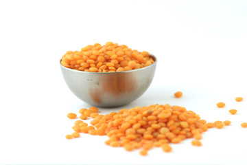 Fototapeta na wymiar red lentil in a bowl isolated on white background