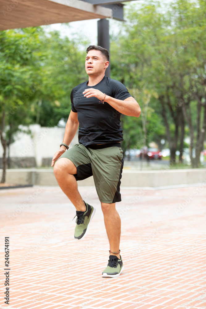 Wall mural Man doing fitness in outdoor park