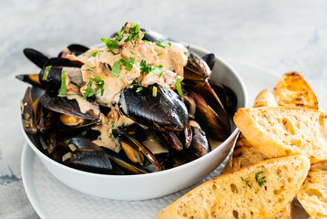 Mussels with herbs in a bowl